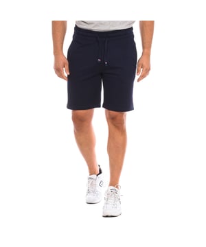 Sports shorts U.S. POLO ASSN.
 Regular fit cotton Bermuda shorts.
 Elastic and adjustable waistband with drawstring,
 Two open pockets on the sides.
 One open back pocket.
 Brand logo on the front.
 Seams seen in tone.
 Composition: 100% cotton
 Care:
Wash at maximum temperature 30º.
 Iron at low temperature.
 Do not use bleach.
 Do not use dryer.
 Do not dry clean.