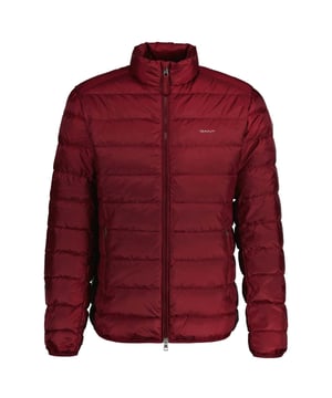 A lightweight layering piece with a water-repellent finish  this down jacket has a stand collar  zipped side pockets and an elasticated hem and cuffs. Designed for a regular fit that sits just above the hips  this jacket is complete with subtle GANT branding at the chest and an embroidered locker loop at the back. Wear alone over shirts or under heavier coats for the winter months. This product has sustainability attributes in all layers: shell  lining and padding. The shell and lining are made from recycled synthetics and the padding is made with certified down and feathers.