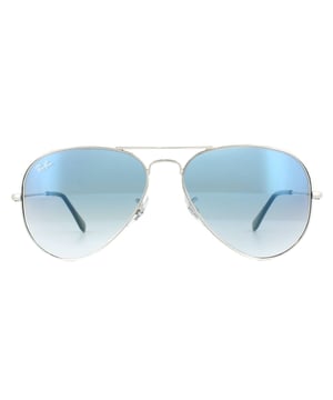 Ray-Ban Sunglasses Aviator 3025 Silver Gradient Light Blue 003/3F 55mm were originally designed in 1936 for US military pilots and have since become one of the most iconic sunglasses models in the world. The timeless design is characterised by the thin metal wire frame, large teardrop shaped lenses and fine metal temples that feature silicone tips and nose pads for a customised and comfortable fit. This classic model is available in various sizes and an array of colourways.