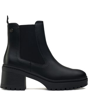 Botas negras con cremallera interior Xti para mujer, fabricadas con sintético y suela de goma. Incluyen: cremallera interior, refuerzo elástico, marca Xti, totalmente forradas y 100 % veganas.