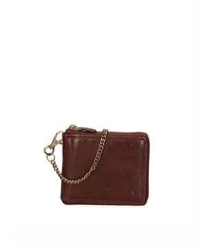Cartera de hombre. El cierre es con cremallera. Los bolsillos internos son tarjeteros para billetes y monedas. Los bolsillos externos están ausentes. Falta la correa para el hombro. Falta el mango. Hay un compartimento interno. El material exterior es 100% Piel Auténtica. Internamente está forrado en piel auténtica. Medidas: 12,5x11x2,5 cm. Producto de moda
