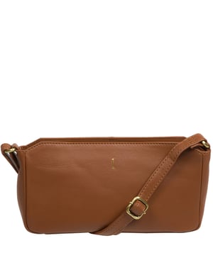 From Cultured London's Soho Collection, the 'Christina' cross body bag is handcrafted from Nappa leather with a soft-to-the-touch and luxurious feel. The main compartment is secured with a concealed zip-over top to retain a unique silhouette which conceals the 100% cotton lined interior with two slip pockets - ideal for organising your bag. A sleek and slim adjustable leather strap with a drop length of 65cm adorns the bag and is complemented by attractive light gold coloured metal fittings. Finished with the minimalist Cultured London logo embossed in gold foil for an eye-catching finish