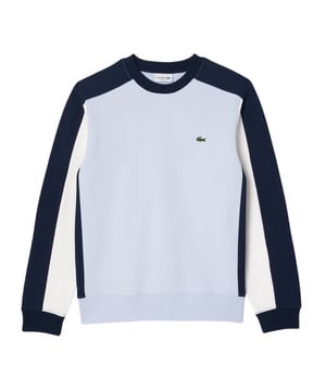 Das Lacoste Herren-Sweatshirt mit Rundhals, Rippbündchen und elastischem Bund präsentiert sich im trendigen Colourblock-Design mit der charakteristischen Krokodil-Applikation. Mit dem Classic Fit bietet es höchsten Tragekomfort und verleiht jedem Outfit eine moderne und stylische Note.
