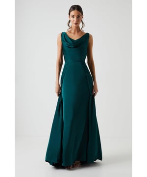 Exquisite cowl neckline drapes elegantly across the dcolletage
Sleeveless design with wide shoulder straps for a refined look
Flattering A-line silhouette skims over curves
Luxurious satin fabric cascades gracefully to the floor
Sophisticated side split adds a touch of allure

Radiate sophistication and grace in this stunning bridesmaids dress from Coast. The rich satin fabric exudes a luxurious sheen, while the cowl neckline and A-line silhouette create an elegant, figure-flattering silhouette. Pair with delicate jewellery and heels for a refined look that will complement the bridal party's ensemble. Perfect for a chic, modern wedding celebration where you can revel in the joy of the occasion while looking impeccably stylish.