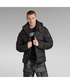 Adjustable peak hood, pull cord inside, raised front -detachable. Quilted, padded design. Broad welt waist pockets- snap button closure. Piping is set alongside the back sleeves. Inside: hanger loop and double inner pocket. Zipper closure- wind blocker underneath, hidden pull cord at the hem. Zip closure. Compact, lightweight fabric made of super fine recycled polyester yarns. Additionally, the fabric is coated with a sustainable PFC-free water repellent finish for optimal functionality. Densely woven