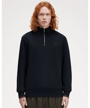 This latest iteration of the Half Zip sweatshirt comes in a stripped back, minimalist design featuring signature Laurel Wreath embroidery and twin tipped cuffs. Fred Perry through and through.79% Cotton / 21% PolyesterM3574