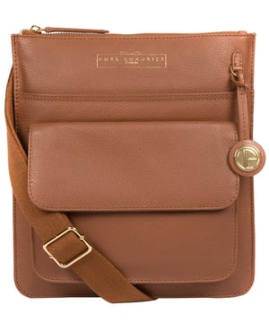 Crafted from supple leather, the 'Langley' cross body bag from Pure Luxuries London elevates a classic design with a luxury finish. A zip-over top fastening conceals the 100% natural cotton lined interior and is complemented by two slip pockets, ideal for maintaining an organised bag. Additional storage space is provided by a slip pocket and a press-stud fastened pocket. Adorned with an adjustable strap and finished with a beautiful Pure Luxuries London charm and logo for an elegant finish.