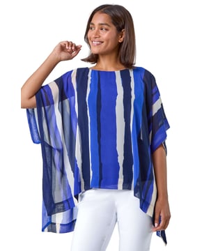 Stripe Print Chiffon Overlay Tunic Top from Roman. Elevate your Spring Summer wardrobe with this stripe print chiffon overlay top. The round neckline and short batwing sleeves are complemented by an asymmetric hem to create a striking silhouette. Complete with side split detail, this top is a versatile staple that is so easy to slip on for any occasion, all year round. The sheer chiffon overlay has a comfortable lining which offers a flattering fit. Simply add heels and cropped trousers for an effortlessly glamorous evening look!