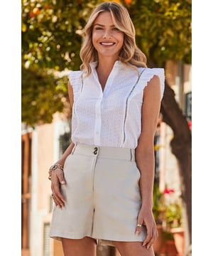 It's ticking all the summer top boxes
Crafted from a breezy lightweight fabric
Sleeve-free for sunny days
Finished with a dreamy ruffle detail
Loose fit you can wear tucked in or out
Just add shorts and sandals