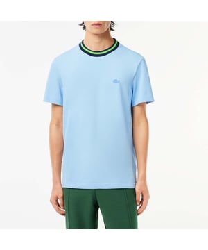 Men's Lacoste Stripe Collar Stretch Piqué T-Shirt.- Regular fit, natural ease on body.- Stretch mini pique, made of organic cotton and elastane.- Striped ribbed collar with contrasted tipping detail.- Tone on tone crocodile at chest. Material: 94% Cotton, 6% Elastane. Ref: TH1131HBP.