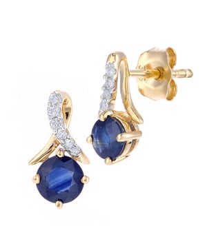 9K (375) geel goud: 0,765 gram; # Diamant: 0,05 ct; # Saffier: 0,59 ct