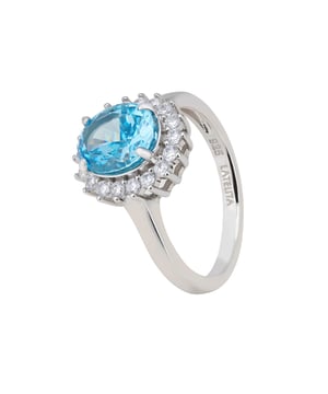 Introducing the "Tatiana Oval Blue Topaz Cocktail Ring Silver" - a dazzling tribute to December's birthstone. This ring is meticulously crafted from premium 925 sterling silver, featuring a beautifully polished band that elegantly cradles an exquisite oval cut lab-created Blue Topaz. This central stone, radiant and full of depth, is the star of the show, encircled by a glittering array of cubic zirconia that enhances its icy blue hues.Available in three versatile sizes, the Tatiana Ring is designed for a perfect fit. The setting, measuring 1.5cm x 1.2cm, perfectly showcases the Blue Topaz, creating a stunning display that’s neither too overpowering nor too understated. With a weight of just 5.0 grams, this ring promises day-long comfort, making it an ideal everyday accessory.For those born in December, this ring holds special significance, celebrating the month of your birth with its stunning Blue Topaz centrepiece. And for the lovers of coordinated elegance, matching earrings and a pendant necklace are also available, allowing for a seamless ensemble. The "Tatiana Oval Blue Topaz Cocktail Ring Silver" is more than just a piece of jewellery; it's a celebration of birth, beauty, and unmatched style.