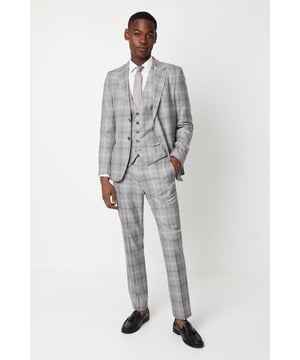 Slim fit tailored trousers with a sleek, tapered silhouette
Crafted from a fine grey check patterned fabric
Flat front styling with slant side pockets
Belt loops to accommodate a smart leather belt
Hem designed to sit neatly on the shoe

Exuding refined sophistication, these slim fit trousers from Burton are the epitome of smart tailoring. Pair them with a crisp shirt and blazer for a polished look at formal occasions or dress them down with a knitted jumper for elevated weekend styling. The slim cut flatters the frame while the grey check pattern adds a touch of classic British flair, making them a versatile choice for the modern gentleman's wardrobe.