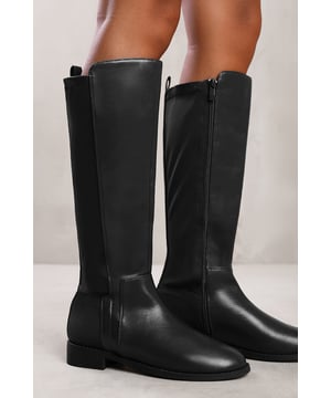 Stay stylish and comfortable all day with our Vanda Knee High Boots with Side Zip. These boots are a perfect addition to your footwear collection, combining style and functionality for a chic look.

Key Features:



Effortless Style: The knee-high design of these boots ensure they make a statement wherever you go. They effortlessly elevate your outfit, adding a touch of sophistication and style.

All-Day Comfort: Our boots are designed with your comfort in mind. The elastic panel at the side allows for flexibility and a snug fit. You can wear them all day without sacrificing comfort.

Secure Fit: The elastic panel at the side of the boots ensures a secure fit around your calves. This allows for easy on and off, while also providing a customized and comfortable fit.

Durable Construction: Made with high-quality materials, our Wedge Heel Knee High Boots are built to last. The sturdy sole and reliable stitching ensure durability, making them practical for everyday wear.


Specifications:


Closure: Side zipper
Calf circumference: Adjustable with elastic panel

Invest in our Vanda Knee High Boots with Side Zip for a perfect combination of style, comfort, and versatility. Enjoy the joy of effortless fashion and confident strides with every step you take. Get yours today and embrace the allure of knee-high boot fashion.