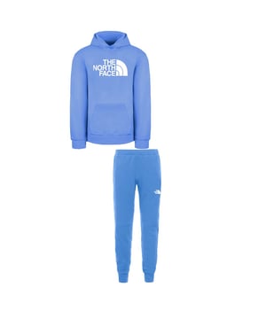 Prepare your little one for comfort and style with The North Face Slacker Kids Tracksuit – a versatile and cozy outfit perfect for various activities. Here's a detailed description highlighting the key features of this kids' tracksuit:
&gt;
 The North Face Logo:  The iconic The North Face logo is likely featured on both the jacket and pants, showcasing the brand's commitment to outdoor exploration and adventure. The logo adds authenticity and a sporty touch to the tracksuit.

 Comfortable Fabric:  Crafted from comfortable and soft fabric, the tracksuit provides a cozy feel against the skin. This is essential for active kids, ensuring they can move freely and comfortably during various activities.

 Elastic Waistband:  The pants are likely equipped with an elastic waistband, providing flexibility and ease of wear. The elastic waist ensures a comfortable fit for active kids who are constantly on the move.

 Versatile Styling:  The coordinated design and solid blue color make this tracksuit versatile for various occasions. It can be worn for casual outings, playdates, or as a comfortable choice for travel.

 Encouraging an Active Lifestyle:  The North Face Slacker Kids Tracksuit is not just clothing; it's an encouragement for an active and adventurous lifestyle. The durable and comfortable design is tailored to keep up with the energy and curiosity of young explorers.