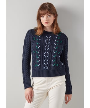 A stylish, transitional knit, our Mia cable knit jumper is an elevated take on the classic cable thanks to its contemporary stitch detail. Crafted from a soft cotton-wool blend in navy blue, it has a round neck, an all-over cable design with green and cream stitching and a regular fit. Wear it over denim or with a pair of wide-leg trousers.