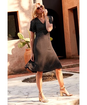 Simultaneously standout and timeless, you’ll be able to rely on this little black dress update for everything from weddings to weekend drinks for seasons to come. The on-point metallic print subtly shimmers as it catches the light, and the On-trend split short sleeves, waist-cinching panelling and a fluid full skirt amplify every body shape. Wear it with high strappy heels and statement gold earrings to up the glamour ante.