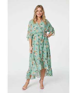 No warm weather collection is complete without a floral wrap dress. With a deep v-neck, batwing 3/4 sleeves with a semi sheer detail, a tie waist and a pephem midi skirt with a high low cut. Style with heeled wedges for an outdoor event or dress down for a sunshine break with sandals.