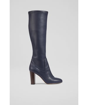 Stretch boots have the best fit, and our new Marlowe knee-high boots offer the perfect sleek silhouette during the winter months, without wrinkling or sagging. Beautifully-made in Italy from stretch vegan leather in classic navy blue, they have an almond-shaped toe and a wooden-stacked block heel. Pull them on and go when temperatures drop.