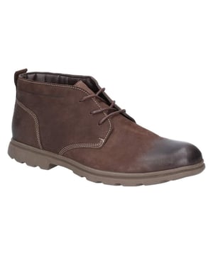 Boven: Verbrand nubuckleder. Voering: Leder, textiel en andere materialen. Een relaxte herenchukka-laars met minimalistische details, comfortabel leer en een dempend lederen voetbed..