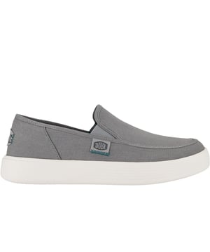 Experience the ultimate blend of classic style and unparalleled comfort with the Sunapee Canvas shoes. Designed for those who appreciate timeless aesthetics, these shoes feature a durable canvas upper that pairs well with any outfit. The comfort cushioned ankle collar provides additional support, while the removable foam insole allows for customization to suit your preferences. The lightweight, flexible outsole is perfect for long strolls, making these shoes travel-ready for any adventure. Step out in style without sacrificing comfort with the Sunapee Canvas.- Textile upper- Slip-on fit- Cushioned footbed- Lightweight design- Durable outsole- Hey Dude branding
