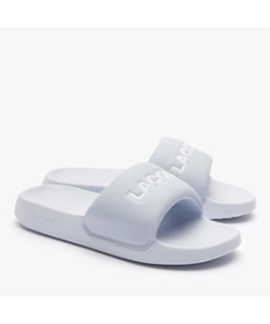 Womens Lacoste Serve 1.0 Sliders in light blue.- Slide sandals- Padded PU strap with Lacoste lettered branding.- EVA footbed- EVA outsole