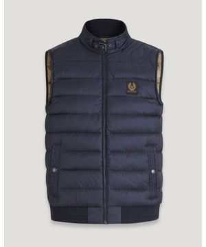 The Circuit gilet has is convenient, versatile, and characterful. Made from high-density nylon and lightweight down, it offers impressive warmth in every fibre. It channels the café-racer spirit into a down-filled vest for urban explorers and country walkers.

High-density, water-repellent nylon fabric
High warmth to weight ratio
Water-repellent
Belstaff phoenix patch
Exposed centre-zip closure
Buckle-adjusted throat latch
Multi-stitched side pockets with snap-button closure
750 fill power down
100% RDS certified down and feather (IDFL CERT TE-00103785)

Shell: 100% polyamide, Lining: 100% polyamideFilling: 90% white duck down, 10% white duck featherRib: 90% cotton, 8% polyester, 2% elastane
105294