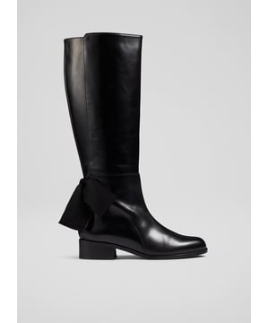 The Callie knee-high boots are crafted in Italy from black calf leather. They have an almond-shaped toe, an inside zip, a black grosgrain ribbon to the back and a 40mm flat heel.
