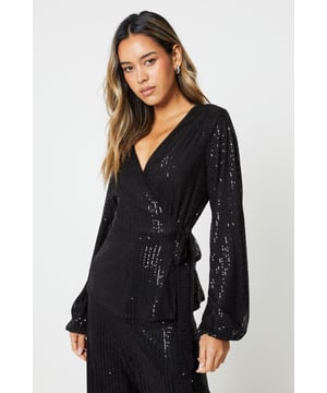 This stylish black sequin wrap top is the perfect addition to your wardrobe. With its sequin embellishments, it adds a touch of glamour to any outfit. The tie waist detail allows you to adjust the fit to your liking, while the wrap design adds a flattering silhouette. Whether you're dressing up for a night out or adding some sparkle to your everyday look, this wrap top is a must-have.