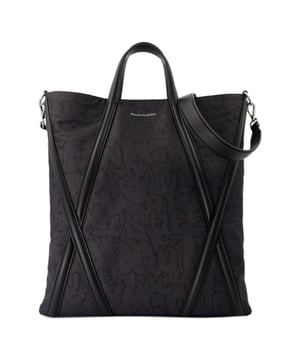 Top handles : 25 cm. Worn two ways - two top handles. Material: nylon. Lining: nylon. Colour : Noir - Black. Nylon. Closure: open top. Interior: one flat pocket.