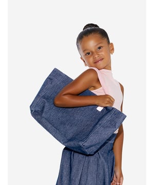 Carry life's essentials in style with this blue tote bag from AY by Ayla. The denim style piece exhibits a chic demeanour, elevating any look. Pink fleece handles are soft on skin and create a cute contrast. Pair with any other AY blue or pink garments for a cool coordinated look.