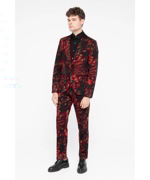 The classical detailing combined with the all-over floral flocking makes the Heron red suit a standout piece for any and all occasions. The jacket features a single button closure with a shawl lapel and jet pockets. The red floral motif all over adds a bold twist to classic tailoring. The trousers feature a flat front with slanted pockets, slanted belt loops and a slim waistband. Style the trousers with the matching skinny fit suit jacket for an opulent approach to formal-wear.