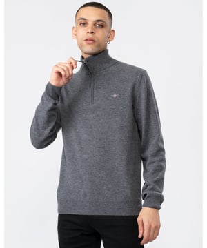Your classic, wear-with-anything sweater. Crafted from 100% superfine lambswool, this sweater with a half-zip collar is perfect for layering. Cut for a regular fit with ribbed detailing at the hem and cuffs, this sweater is versatile and soft enough to justify getting one in every color.
Regular fit  Half-zip collar  Rib endings at hem and sleeve cuffs  GANT graphic embroidered at chest
&nbsp;
Lambswool 100%
&nbsp;
87213
&nbsp;
&nbsp;