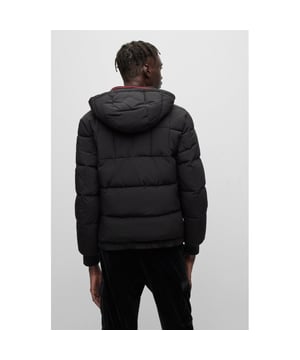 The Stacked Logo Water Repellent Hooded Puffer Jacket from HUGO is a contemporary puffer jacket infused with HUGO DNA, the perfect piece to refresh your outerwear. Crafted from a water-repellent fabric shell with warm and lightweight padding for a cosy feel. Featuring an adjustable drawstring hood, a full zip closure, side welt pockets, elasticted trims and a slim fit cut. Finished with a signature stacked HUGO logo on the chest.Slim Fit, Water Repellent Polyester Shell, Recycled Polyester Padding, Adjustable Drawstring Hood, Full Zip Closure, Twin Side Welt Pockets, Elasticated Cuffs & Hem, HUGO Branding. Style & Fit:Slim Fit, Fits True to Size. Composition & Care:Shell: 100% Polyester, Fill: 10% Recycled Polyester, Professional Clean.