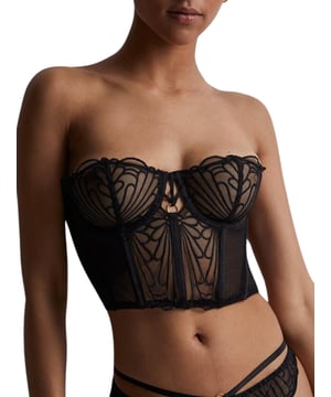 Aubade L'Indomptable Bustier. Sheer underwired bustier with embroidery and non padded demi cups. Matching briefs available. This item is recommended for hand wash only.