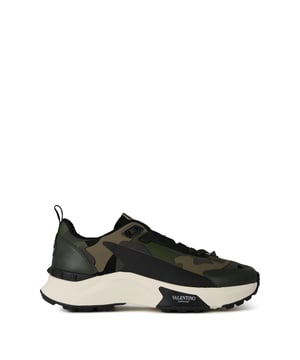 Mens Valentino Low Top True Act Camouflage Trainers in camo.- Synthetic upper.- Lace up fastening.- Pull tab at heel.- Screen-printed logo on tongue.- Rockstud panel on heel.- Logo print on sole.- Logo-stamped appliqué at padded heel.- All-over camo design.- Rubber sole.- Ref: 5Y2S0162UPS