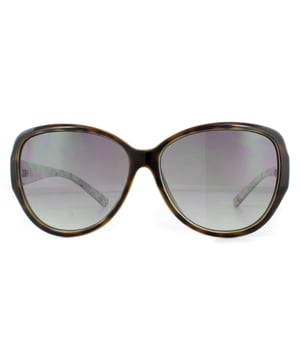 Die Ted Baker Sonnenbrille TB1394 Shay 112 Tortoise Green Grey Gradient ist ein ultrafeminines, ovales Modell mit einem hübschen Blumenmuster auf der Innenseite der Bügel und dem Ted Baker-Logo.
