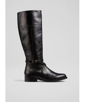 Offering comfort, elegance and practicality, a classic flat riding boot is an essential winter style. Crafted in Italy from beautiful black calf leather with a polished finish, our Bonnie knee-high riding boots have an almond-shaped toe, an inside zip and equestrian-inspired crossover straps with gold buckle detail. Wear them with dresses and skirts or with trousers tucked in.