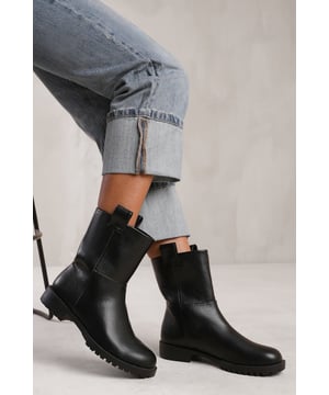 Step into the spotlight with our Winter Mid Calf Boot With Stitching Detail. These stylish boots are designed to make a statement and add a touch of sophistication to any outfit.

Key Features:



All-Day Comfort: The cushioned insole and mid block heel provide support and stability, allowing you to walk confidently and comfortably all day long.

Easy to Wear: The Slip On make it easy to slip these boots on and off, saving you time and hassle.

Versatile and Trendy: These boots are suitable for a range of occasions and can be paired with various outfits. Whether you're heading to the office or going out for a night on the town, these boots will add a touch of sophistication to your look.


Specifications:


Material: Faux Leather
Closure: Slip on
Heel Height: 3' (7.6cm) approx

Invest in our Winter Mid Calf Boot With Stitching Detail for a perfect combination of style, comfort, and sophistication. Make a statement and turn heads wherever you go. Get yours today and step into a world of fashionable elegance!