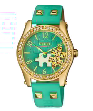 “Y  ou little rebel, I like you.”          This line, which is quoted on the caseback of the watch, is the essence of the Gravesend collection. The studded puzzle piece standing out of the dial face is unconventional. The perfectly matching dial color, bezel crystals and band leather all come together to help bring out that unique personality and attitude that we all want to be.Rebel Gravesend Teal Dial Women's Watch RB111-9121
Rebel Women's Watch from the Gravesend Collection
Round 316L Stainless Steel Gold Case
Teal Dial, Mineral Crystal w/ Sapphire Coating
Teal Leather Band with Tang Buckle
Water Resistance: 5 ATM (50 meters, 165 feet)
12mm Case Thickness, 40mm Case Diameter, 20mm Band Width
Quartz Movement