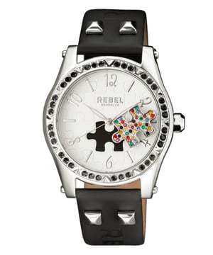 “   you little rebel, I like you.”           This line, which is quoted on the caseback of the watch, is the essence of the Gravesend collection. The studded puzzle piece standing out of the dial face is unconventional. The perfectly matching dial color, bezel crystals and band leather all come together to help bring out that unique personality and attitude that we all want to be.Rebel Gravesend White Dial Women's Watch RB111-4021
Rebel Women's Watch from the Gravesend Collection
Round 316L Stainless Steel Silver Case
White Dial, Mineral Crystal w/ Sapphire Coating
Black Leather Band with Tang Buckle
Water Resistance: 5 ATM (50 meters, 165 feet)
12mm Case Thickness, 40mm Case Diameter, 20mm Band Width
Quartz Movement