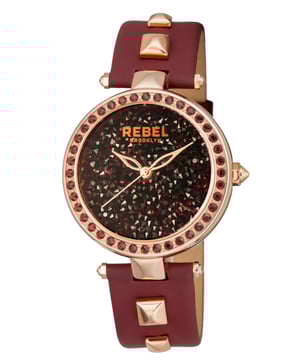“  too fabulous to fit in”          This line, which is quoted on the caseback of the watch, is the essence of the Rockaway Parkway collection.    The crystal filled dial and crystal bezel    meet a leather band with two studs on each BACK. The beauty of this watch is truly too fabulous for pretentiousness.Rebel Rockaway Parkway Rose Dial Women's Watch RB101-8181
Rebel Women's Watch from the Rockaway Parkway Collection
Round 316L Stainless Steel Rose Case
Rose Dial, Mineral Crystal w/ Sapphire Coating
Burgundy Leather Band with Tang Buckle
Water Resistance: 5 ATM (50 meters, 165 feet)
11mm Case Thickness, 40mm Case Diameter, 20mm Band Width
Quartz Movement