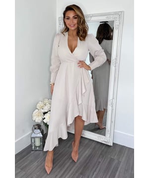 Look sophisticated in this Stone Long Sleeve Frill Wrap Midi Dress.
Featuring gold button cuff sleeves, a wrap v- neck top, frill hem and
a zip up back. Dress up this midi with perspex heels and jewellery. 

Model wears: UK 8/ EU 36/ US 4
Model's height: 173cm/ 5'8"
Approx length from centre back to hem: 142cm
Fabric composition:
Colour: STONE