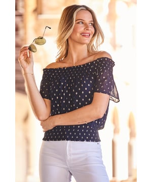REASONS TO BUY: 

Your day-to-night dream top
Ultra-feminine ruched Bardot neckline
Shirred hem for comfort and style
Luxe gold metallic spot print
Wear it with jeans and heels for drinks
Style with shorts and sandals on holiday