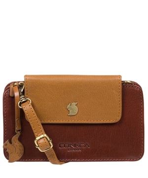 The 'Little Wonder' cross body clutch bag from Conkca London is handcrafted from multi-toned leather for a beautiful finish. A magnetic press-stud secured cover opens to reveal a compartment ideal for a smartphone. A zip-over top opens to reveal a second compartment that is perfect for your essential items and has three handy card slots. Lined with natural and untreated 100% cotton. It comes with an adjustable leather strap with a maximum drop length of 68cm, which is removable, converting the bag into a clutch bag. Adorned with the inimitable Conkca squirrel charm and Conkca logos.