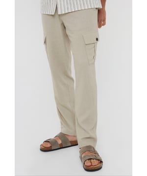 Upgrade your wardrobe with these linen blend cargo trousers from Threadbare. These linen mix cargos are the perfect blend of comfort and style, and with a part elasticated waistband with drawcords, they hit the laidback luxe trend with ease. Cut in a regular fit with a twin needle stitched hem, belt loops, mock horn button and zip fly closure. Linen-rich, these trousers will keep you cool and comfortable all day long, and have two side pockets, two back pockets, along with a button closure pocket on each leg. Team with a casual shirt to complete the look.