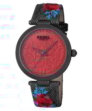 “W   hy fit in when you were born to stand out?”           This line, which is quoted on the caseback of the watch, is the essence of the Carrol Gardens collection. The dial with its leather look embossed with roses complements the canvas covered leather band with a floral print design. You were born to stand out and with this watch you will achieve your aspirations.Rebel Carroll Gardens Burgundy Dial Women's Watch RB112-6181
Rebel Women's Watch from the Carroll Gardens Collection
Round 316L Stainless Steel Black Case
Burgundy Dial, Mineral Crystal
Black Cloth Band with Tang Buckle
Water Resistance: 5 ATM (50 meters, 165 feet)
9mm Case Thickness, 40mm Case Diameter, 20mm Band Width
Quartz Movement