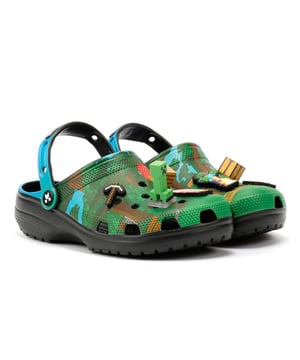 Kids' Minecraft-inspired clogs featuring 3D block Jibbitz™ charms for a playful, game-themed design. Crafted with a soft, flexible upper and ventilation holes for enhanced breathability, keeping feet cool. Perfect for water or sand play with quick-drain functionality.