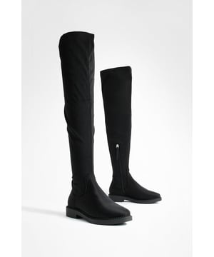Over-the-knee design for a bold, statement look
        Wide fit for enhanced comfort and versatility
        Stretch material allows for easy on-and-off
        Low heel height between 2.5 and 4.5cm for all-day wearability
        Sleek, minimalist silhouette suitable for various outfits
    
    Step into style with these versatile over-the-knee boots, perfect for the fashion-forward woman who values both comfort and trend-setting looks. The wide fit and stretch material ensure a snug yet accommodating fit, making them ideal for all-day wear. With their low heel, these boots offer the perfect balance of elegance and practicality, suitable for a range of casual occasions. Style them with a mini skirt and oversized jumper for a chic autumn ensemble, or pair with skinny jeans and a longline coat for a sophisticated winter look. Whether you're heading to a family gathering or a casual night out with friends, these boots will keep you looking effortlessly stylish while maintaining comfort throughout your day.