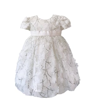 We've ventured out of our comfort zone with reagrds to fabric on this style. We've never used silver sequins on our dresses before now. We love the result in this style TULA, that is perfect for Bridesmaids, Flowergirls, Christenings or Naming Ceremonies.

The fabric is a soft organza with sequins and cut flower shapes all over it. Pretty puffed sleeves and a wide sash belt that ties at the back in a big bow. Truly magical and great for twirling!

We've lined the dress in a fine lawn fabric made of 100% cotton so it's cool and comfortable to wear and a good option for any little girls with sensitive skin.
All our dresses arrive with you on a satin padded hanger to keep the dress in perfect shape, and then protected by one of our Heritage garment keepsake bags.
Outer - 100% polyester excluding sequin trims
lining - 100% cotton
Dry clean or Hand wash only